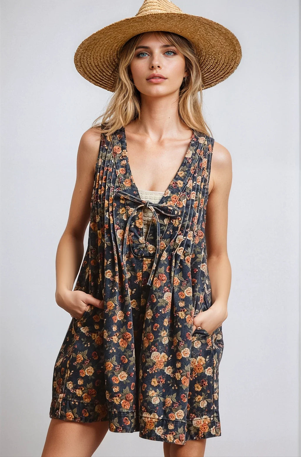 Woman wearing a vintage floral print denim romper