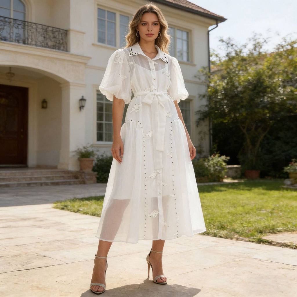 Woman wearing an embellished puff-sleeve two-piece maxi dress set