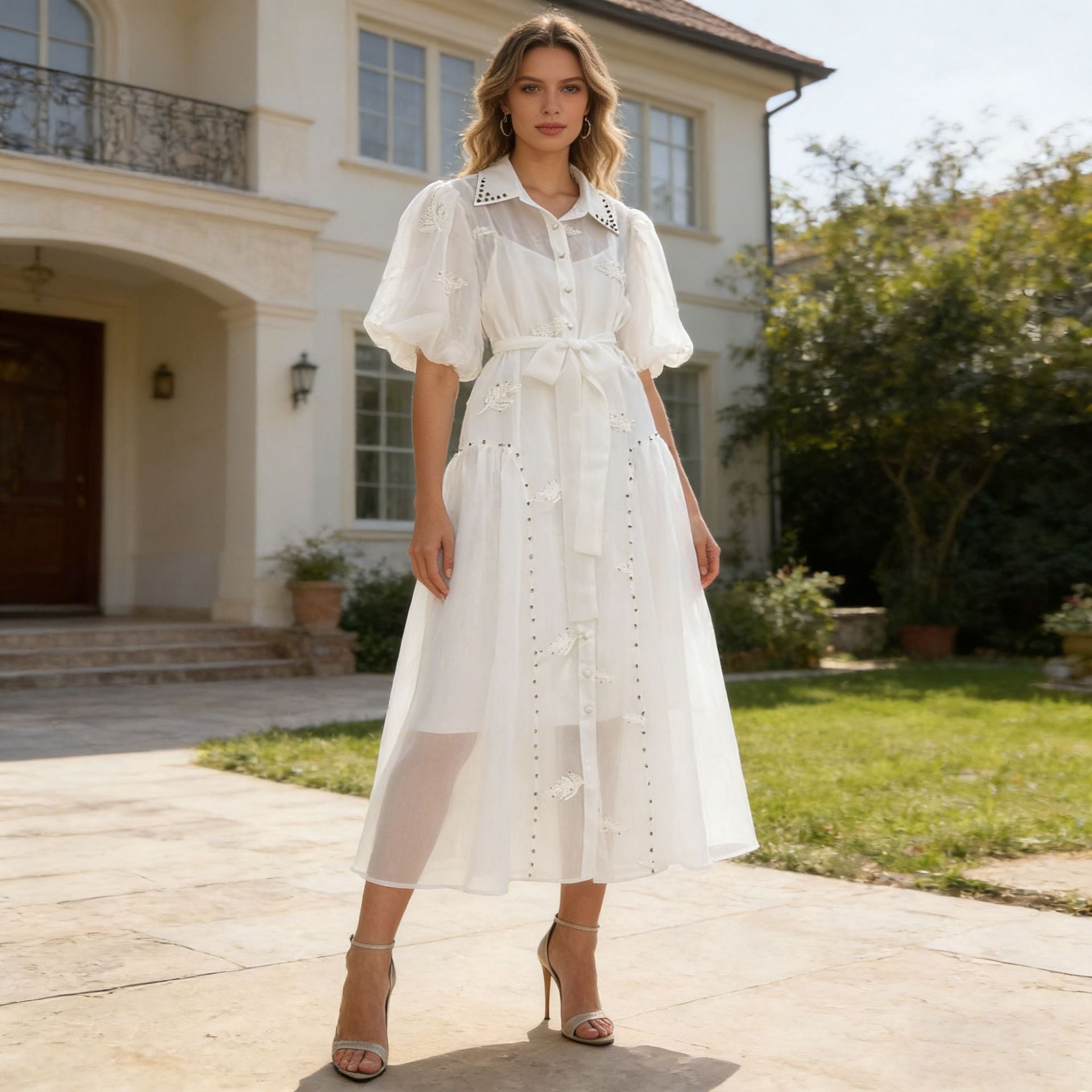 Woman wearing an embellished puff-sleeve two-piece maxi dress set