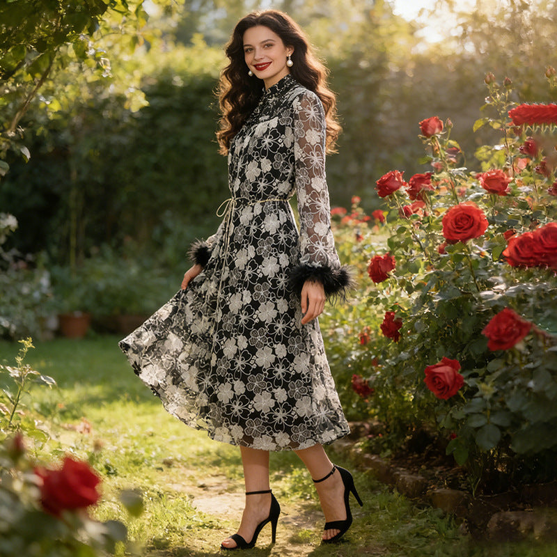 Woman wearing a beaded floral bell-sleeve maxi dress