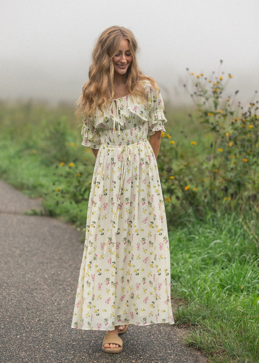 Woman wearing a floral puff-sleeve maxi dress